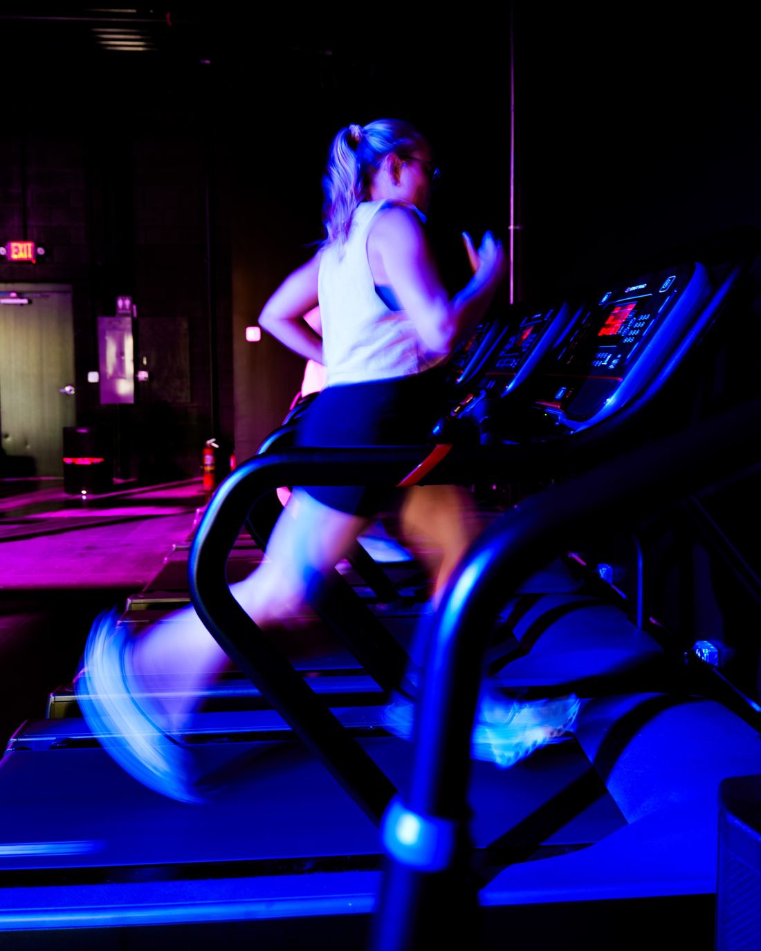 A member sprinting on a treadmill